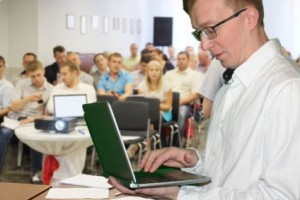 The audience listens to the acting in a conference hall